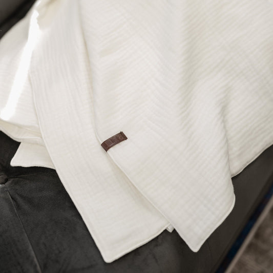 Vauvan musliinipuuvillapeitto Norsunluunvalkoinen